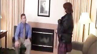 A fat woman in stockings pleases her boss with her huge boobs