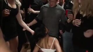 A sexy woman in stockings is fucked by several guys at once
