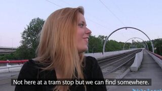 A hot blonde is having fun with someone in the bushes on Karachi
