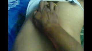 A husband makes a massage for her sensitive spots