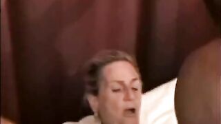 A mature woman is having sex with a black guy with big cock