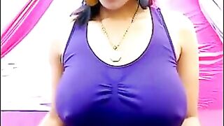 Her nipples stand out through the T-shirt with excitement