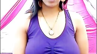 Her nipples stand out through the T-shirt with excitement