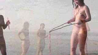 A young girl is fucking on the beach without any clothes