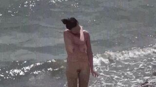 A couple of free-spirited lovers on a nudist beach