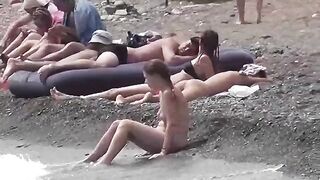 A couple of free-spirited lovers on a nudist beach