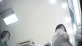 A hidden camera at the checkout in the store shoots girls under their skirts