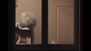 He admires himself in the mirror, completely naked and ready to go