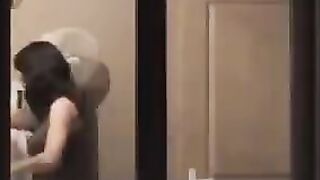 He admires himself in the mirror, completely naked and ready to go