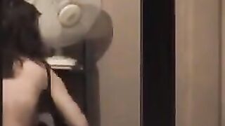 He admires himself in the mirror, completely naked and ready to go