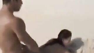 A couple has fun on the beach without any clothes