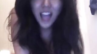 Asian beauty masturbates herself on the bed, showcasing her solo skills
