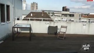 A hot brunette with big tits bounces on the cock on the roof