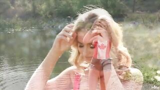 Blonde tenderness caresses herself on the shores of the lake