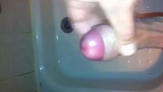 The kid caresses himself with his hand under the shower, aiming for a climax