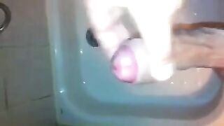 The kid caresses himself with his hand under the shower, aiming for a climax