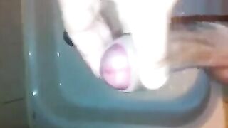 The kid caresses himself with his hand under the shower, aiming for a climax