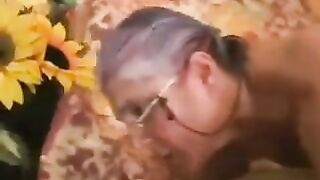 An adult man fucked a gray-haired woman in black stockings