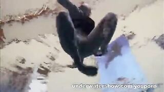 A naked girl is having fun in the swimming pool