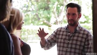 A blonde with fake big boobs has sex on the bed
