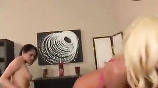 Two hot lesbians have fun while fingering each other’s pussy through their skirts