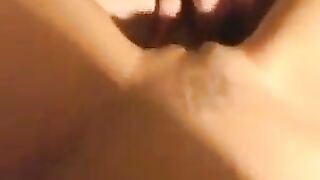 A sexy woman with a great body has sex on the bed, captured in stunning close-up detail