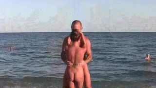 A naked girl is doing gymnastics on the beach