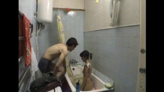 A girl has sex with her stepbrother in the bathroom, caught on camera