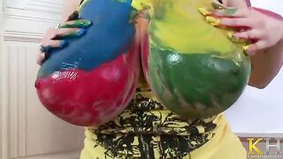 The artist creates a new picture with her fingers and big boobs