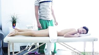 A hairy pussy is fingered and spanked during a sensual massage