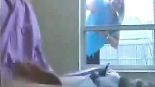 A patient is masturbating, and a woman comes to check on him in the ward