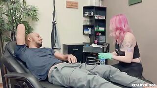 The tattooed guy has sex with a woman with black skin