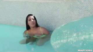A hot girl is having fun with the guy in the pool