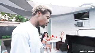 A black guy has sex with a girl at the barbecue in the spring