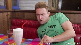 Blonde is greasing her big tits in the diner toilet, showcasing some intense action
