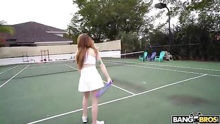 The girl is having fun with the tennis coach on the court