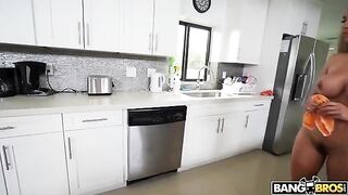 A mature woman is completely naked while doing cleaning
