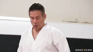 The girl gets fucked in an uncomfortable pose by a trainer
