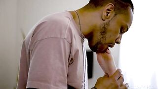 Blonde woman licked by a black man with a tattoo, embodying passion