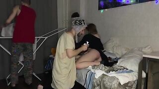 The little girl was fucked by two guys at a party, showcasing raw energy