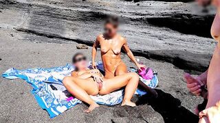 A naked girl rubs her pussy on the beach and makes a guy cum
