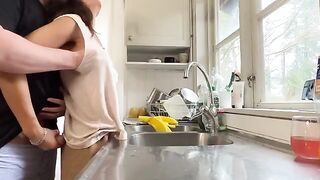 A hot brunette MILF with huge natural boobs gets fucked in the kitchen