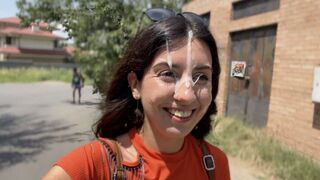 A girl is fucking on the street and gets a huge cumshot on her face