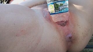 A busty beauty has reached the peak of pleasure while indulging in outdoor play