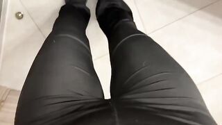 A girl was jerking in the public toilet, her ass captivating