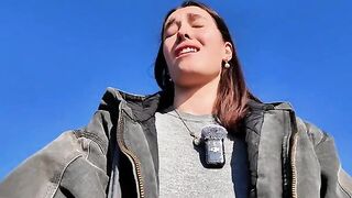 A hot brunette babe masturbating on the public beach