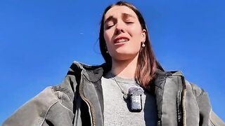 A hot brunette babe masturbating on the public beach
