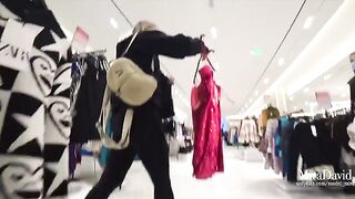 Naughty girl fucks in the fitting room and almost gets caught